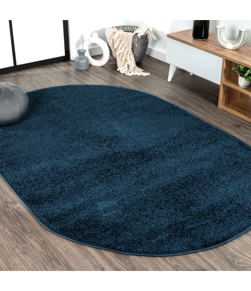 SUPERSOFT Area Rug Haze Solid Low-Pile Navy 6 ft. x 9 ft. Oval Area Rug