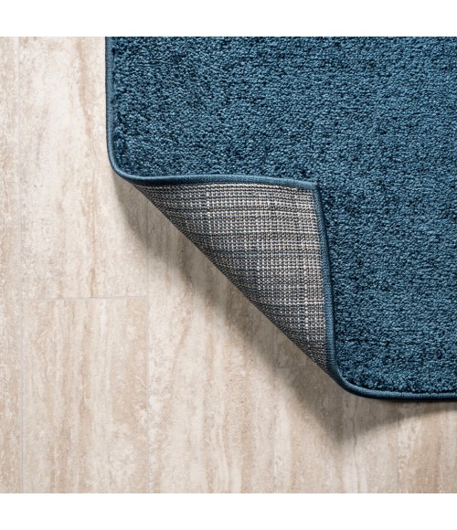 SUPERSOFT Area Rug Haze Solid Low-Pile Navy 6 ft. x 9 ft. Oval Area Rug