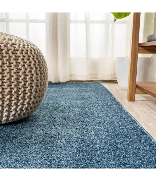 SUPERSOFT Area Rug Haze Solid Low-Pile Navy 6 ft. x 9 ft. Oval Area Rug