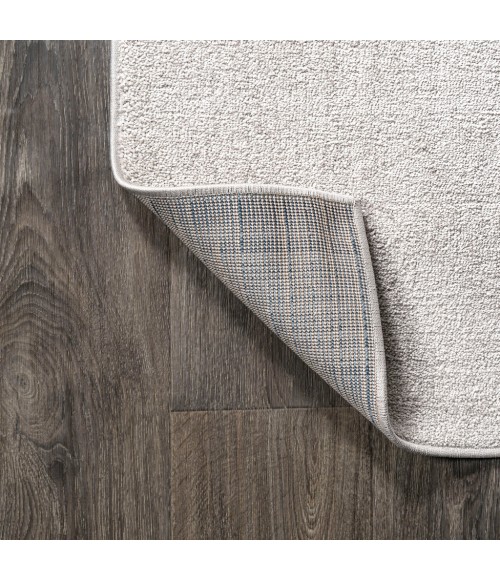 Haze Solid Low-Pile Ivory 3 ft. x 5 ft. Oval Area Rug