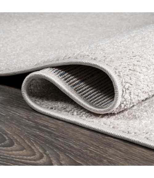 Haze Solid Low-Pile Ivory 3 ft. x 5 ft. Oval Area Rug