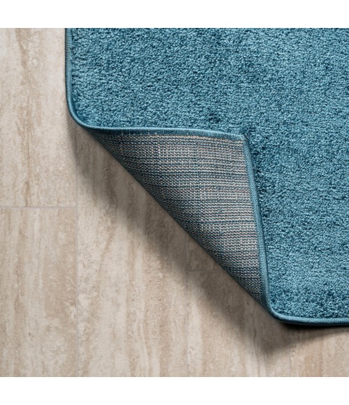 SUPERSOFT Area Rug Haze Solid Low-Pile Turquoise 5 ft. x 8 ft. Oval Area Rug