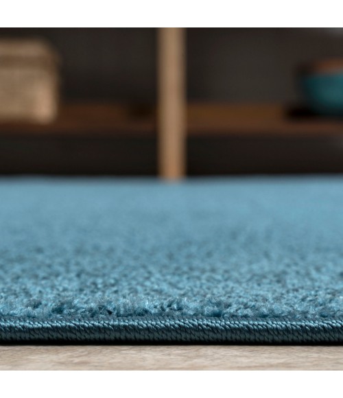 SUPERSOFT Area Rug Haze Solid Low-Pile Turquoise 5 ft. x 8 ft. Oval Area Rug