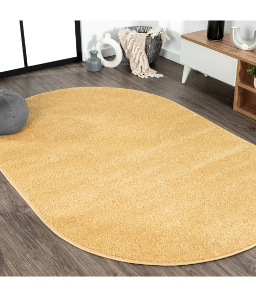 Haze Solid Low-Pile Mustard 5 ft. x 8 ft. Oval Area Rug