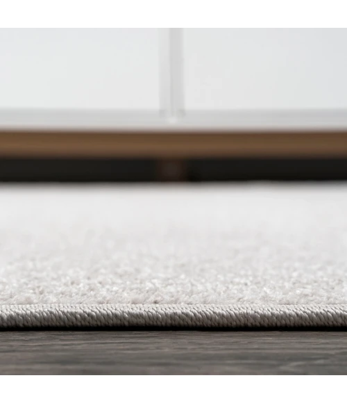 Haze Solid Low-Pile Ivory 6 ft. x 9 ft. Oval Area Rug