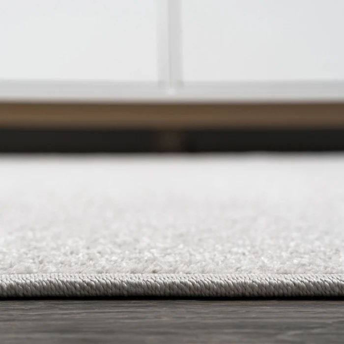 Haze Solid Low-Pile Ivory 5 ft. x 8 ft. Oval Area Rug