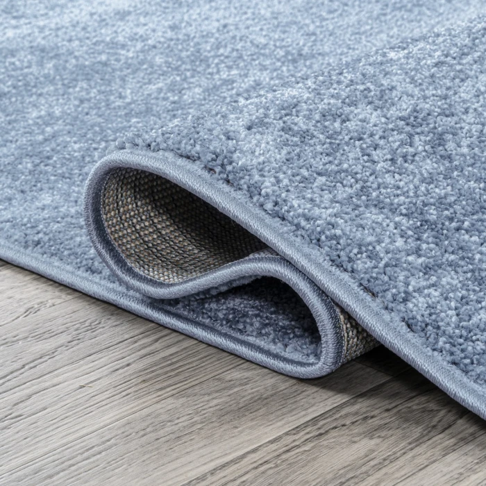 Haze Solid Low-Pile Classic Blue 6 ft. x 9 ft. Oval Area Rug