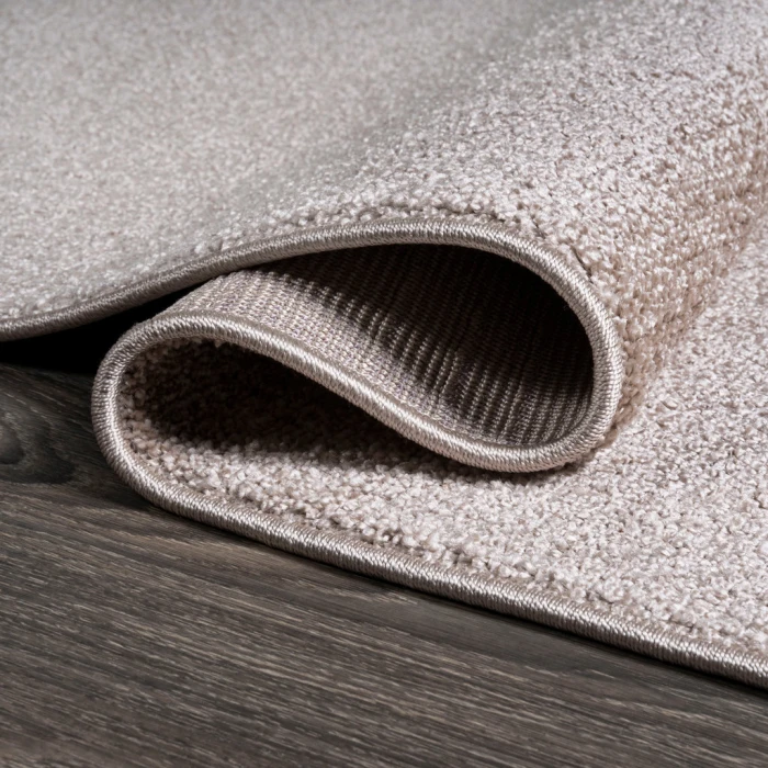 Haze Solid Low-Pile Beige 3 ft. x 5 ft. Oval Area Rug