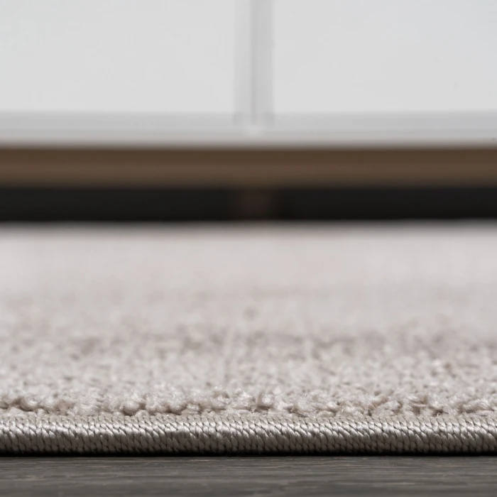 Haze Solid Low-Pile Beige 5 ft. x 8 ft. Oval Area Rug