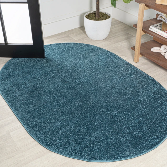 Haze Solid Low-Pile Turquoise 6 ft. x 9 ft. Oval Area Rug
