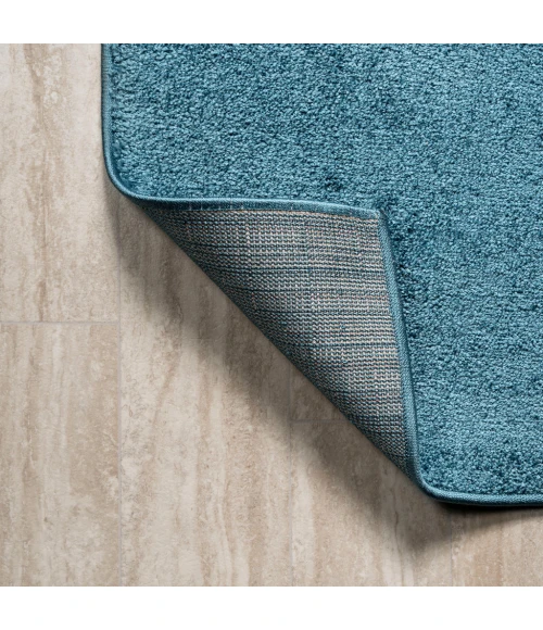 Haze Solid Low-Pile Turquoise 5 ft. x 8 ft. Oval Area Rug