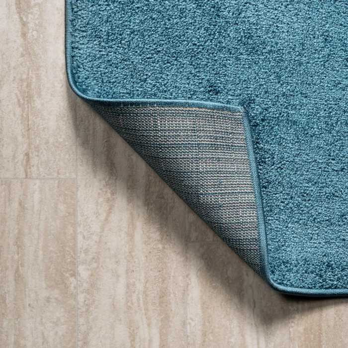 Haze Solid Low-Pile Turquoise 6 ft. x 9 ft. Oval Area Rug