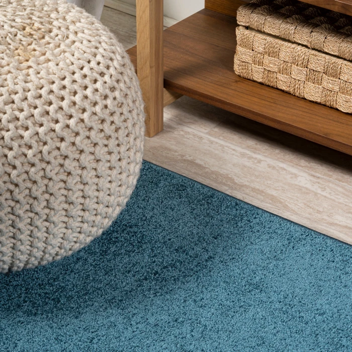 Haze Solid Low-Pile Turquoise 6 ft. x 9 ft. Oval Area Rug