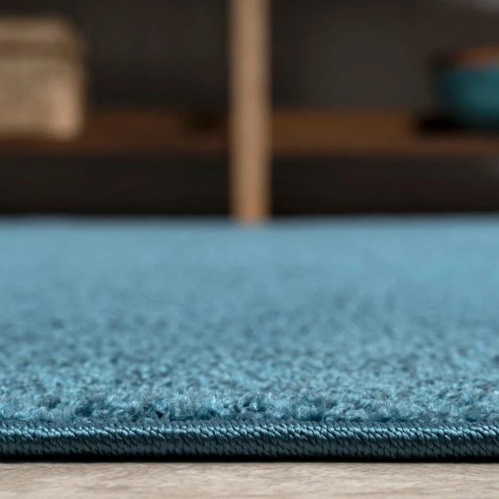 Haze Solid Low-Pile Turquoise 6 ft. x 9 ft. Oval Area Rug