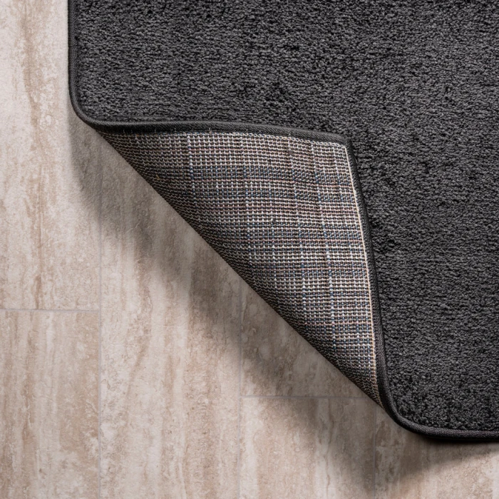 Haze Solid Low-Pile Black 6 ft. x 9 ft. Oval Area Rug