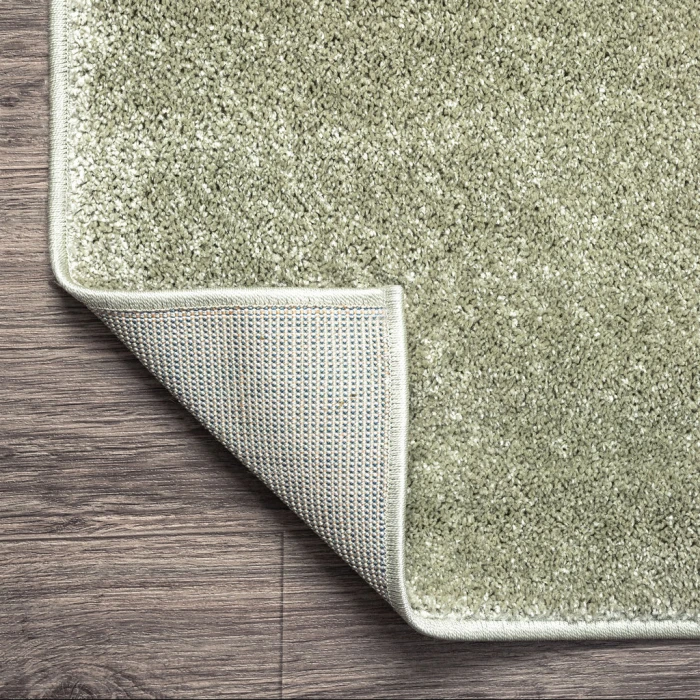 Haze Solid Low-Pile Green 5 ft. x 8 ft. Oval Area Rug