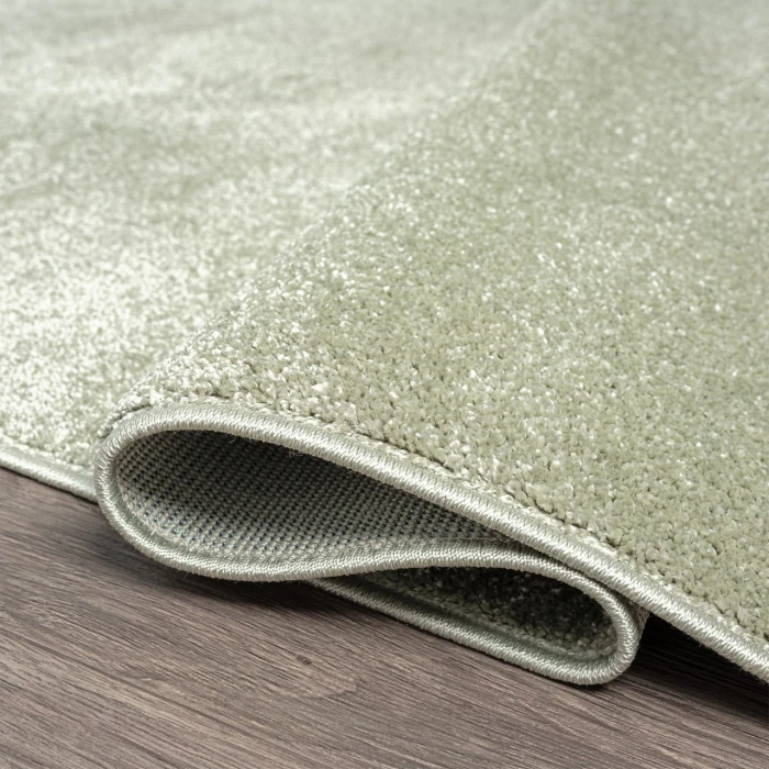 Haze Solid Low-Pile Green 5 ft. x 8 ft. Oval Area Rug