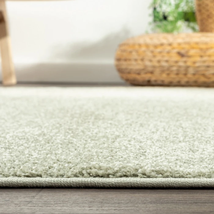 Haze Solid Low-Pile Green 5 ft. x 8 ft. Oval Area Rug
