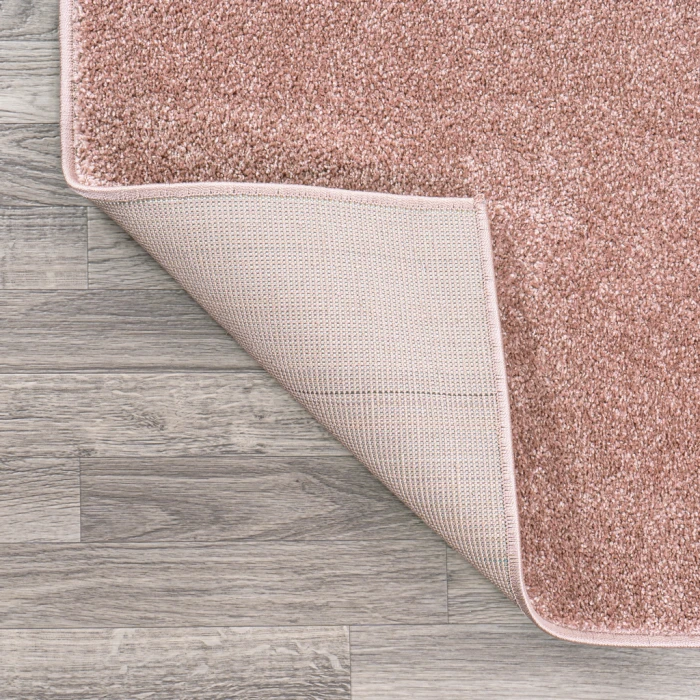 Haze Solid Low-Pile Pink 6 ft. x 9 ft. Oval Area Rug