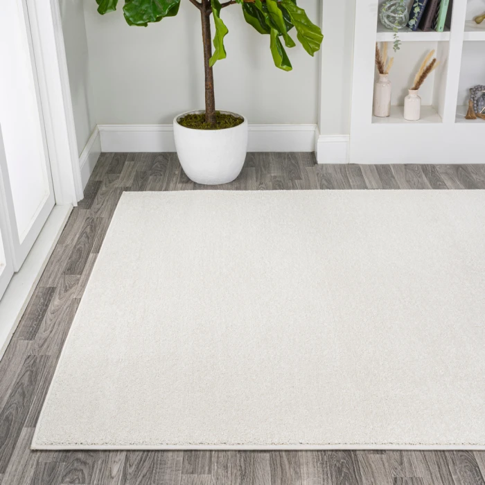 Haze Solid Low-Pile Cream 10 ft. x 14 ft. Area Rug