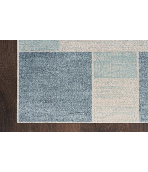 Nourison Astra Machine Washable Blue Ivory ASW09 6 ft. 7 in. X 9 ft. Rectangle Rug